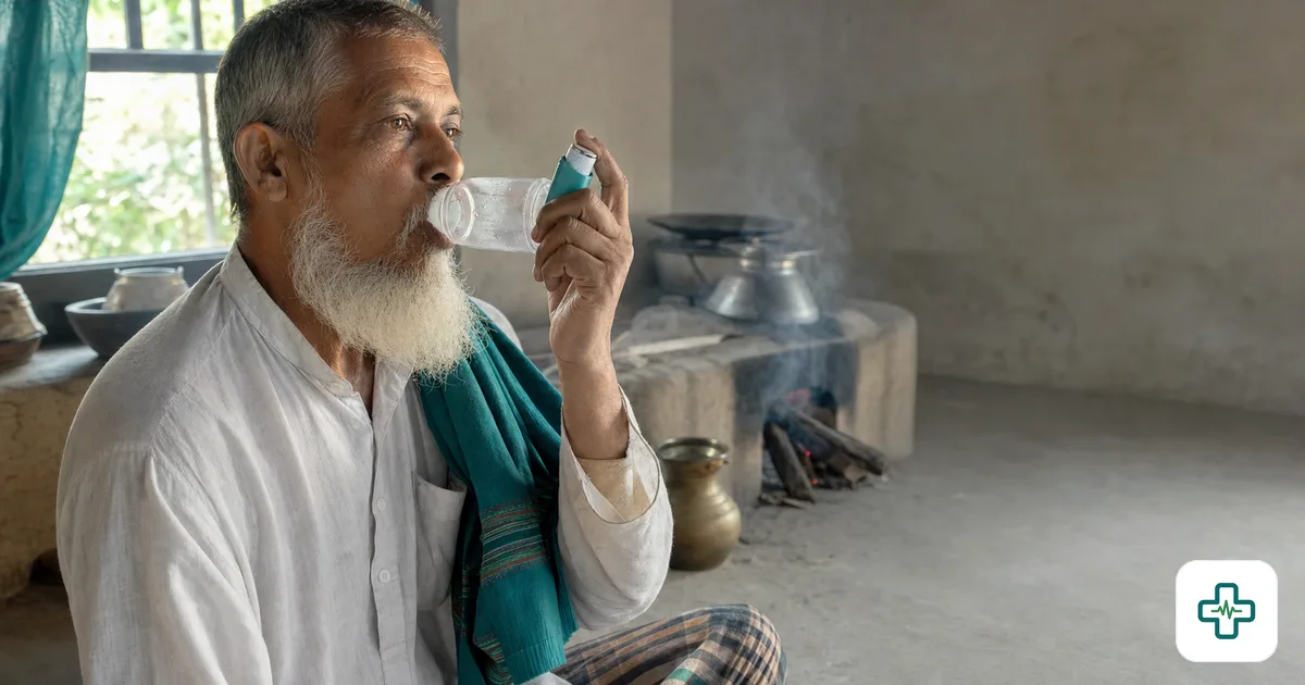 A photorealistic image of an older Bangladeshi man using a metered-dose inhaler with a spacer near a smoky wood cooking stove in a home